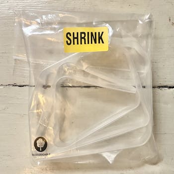 Lyon Shrink Sleeve clear plastic tubing rolled up on plastic bag